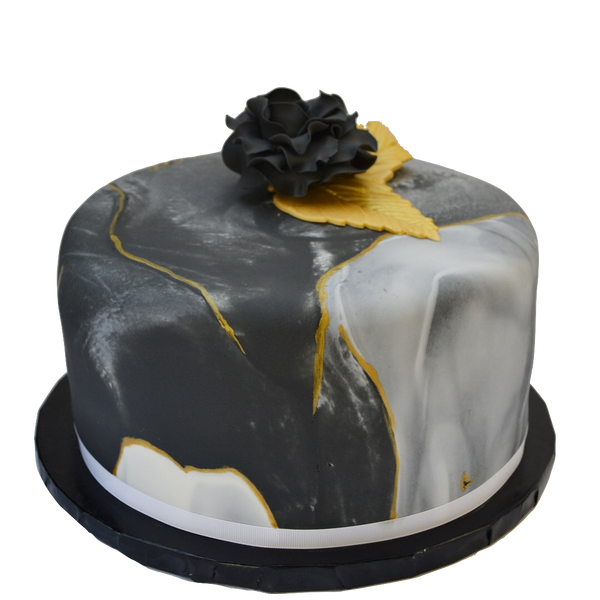 Black marble lemon cake with gold accents and an edible black rose, filled with lemon curd and a light lemon icing in between layers. Sugar Street Boutique toronto cakes.