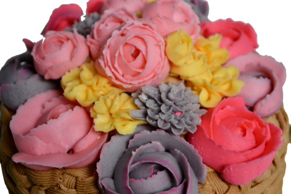 Carrot cake with cream cheese icing decorated with yellow, pink, grey flowers and roses and basket icing by Sugar Street Boutique Toronto