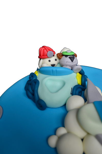 A fully loaded cake with a plane, boat and a train with Marshall & Rocky from Paw Patrol by sugar street boutique
