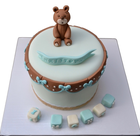 light blue cake with a fondant edible bear to celebrate a baby's first month. 100 days cake. sugar street boutique. toronto cakes. edible blocks.