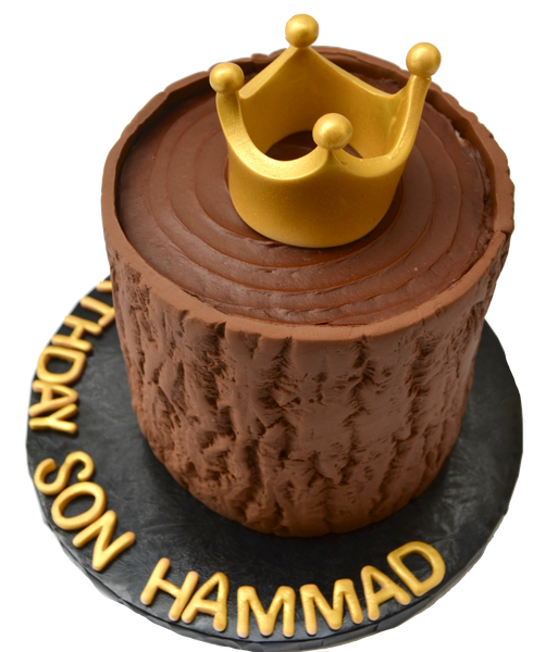 tree trunk cake with a gold edible crown on top, chocolate cake for a birthday by sugar street boutique toronto cakes