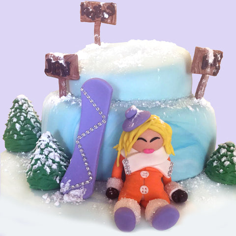 Snowboard Girl Fondant Cakes Designs by Sugar Street Boutique Toronto Canada snowboard snow blonde snowboarder lemon cake winter cake purple snowboard all edible