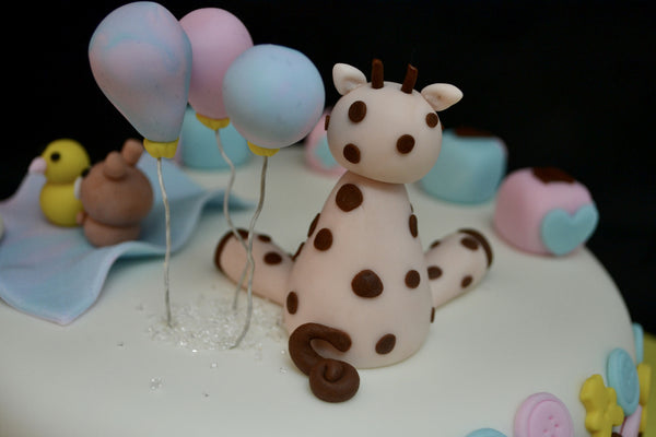 Baby Shower chocolate cake by Sugar Street Boutique decorated with fondant.