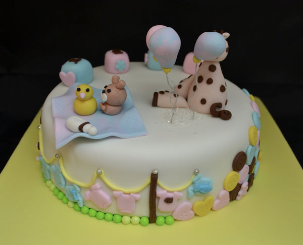 Baby Shower chocolate cake by Sugar Street Boutique decorated with fondant.