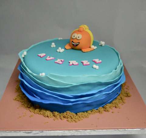 Bubble Guppies character Mr. Grouper chocolate cake covered with fondant and edible figurines by Sugar Street Boutique Toronto made for a birthday.