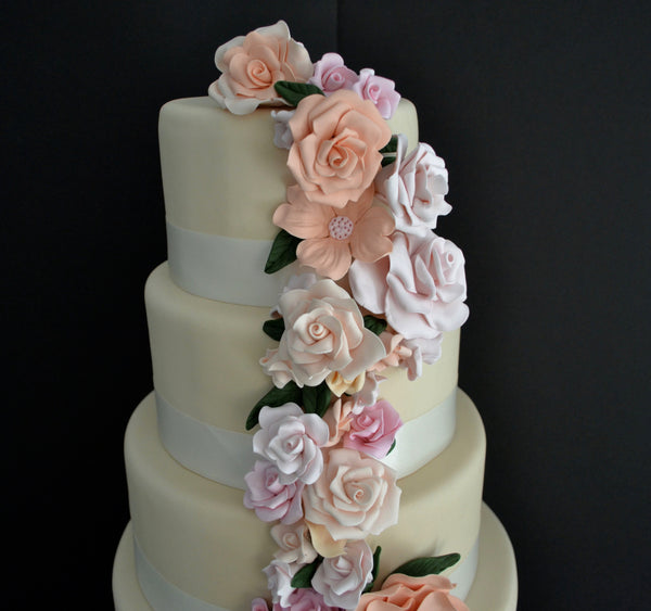 5 Tier Wedding Floral drapping Cake with soft pink and peach colors made by Sugar Street Boutique Toronto