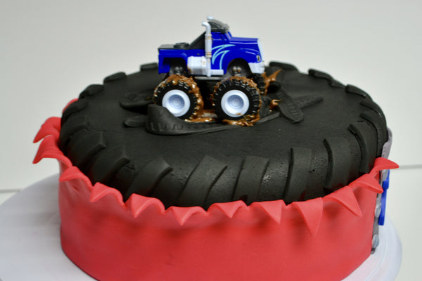 monster truck red velvet cake with a big tire by sugar street boutique toronto