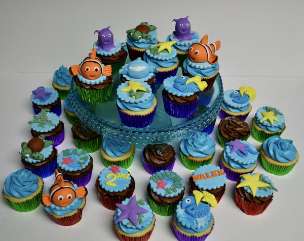 Nemo & Dory cupcakes with a sea theme, fondant turtle, fondant shark, fondant dory, fondant nemo, birthday cupcakes by sugar street boutique toronto
